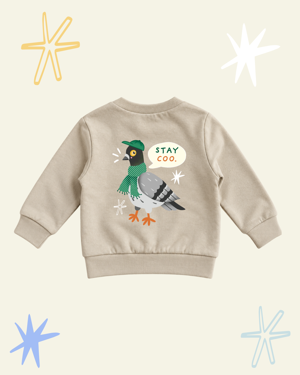 Back of beige Stay Coo. kids' sweatshirt with a large pigeon illustration and Stay Coo. speech bubble.