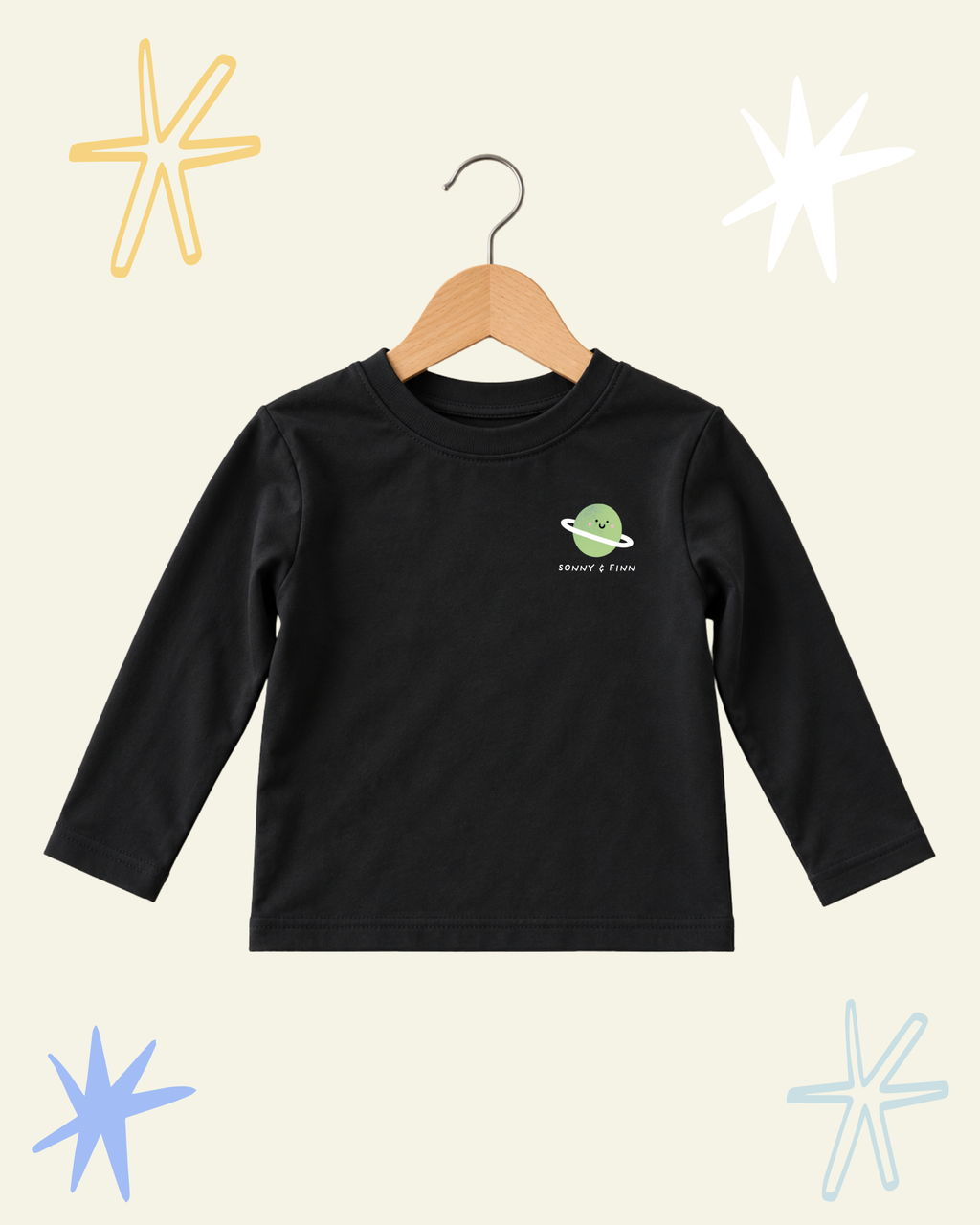 Front of black Stargazer long sleeve T-shirt with a small green ringed planet above the Sonny and Finn logo.